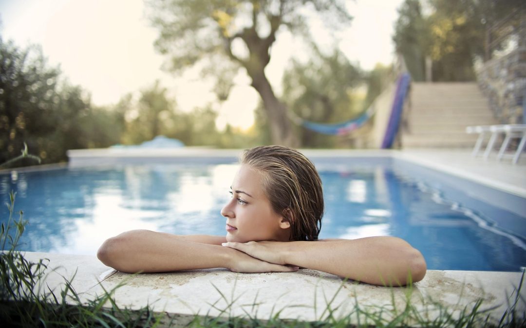 woman at pool and pool pump repairs services toronto