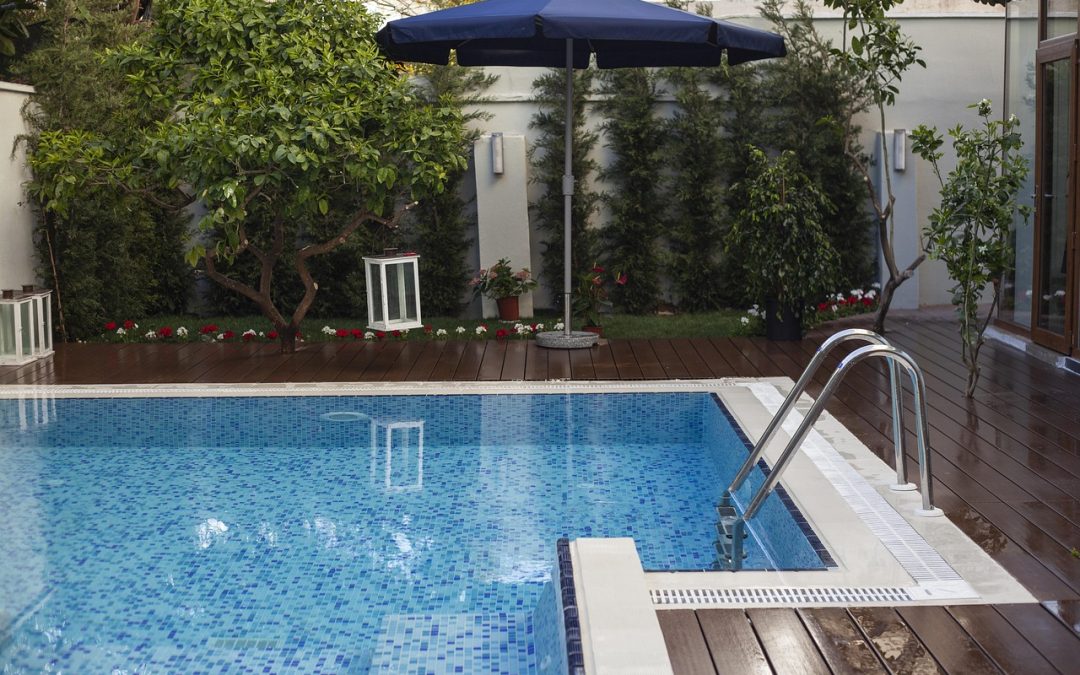 swimming pool with umbrella. pool pump maintenance gta